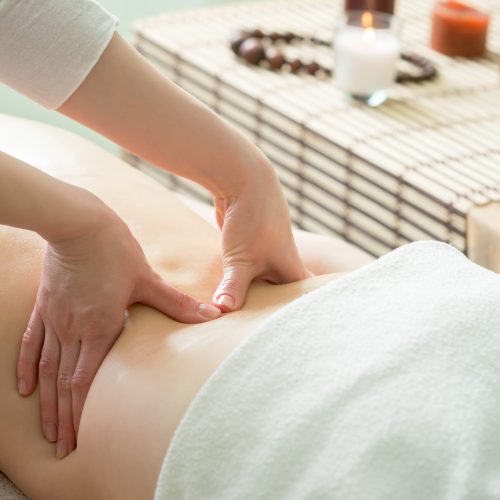 Hands close-up of a massage therapist at the time of the massage